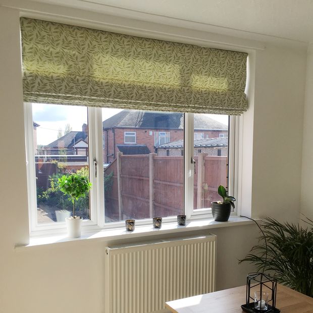 Folia sage roman blinds in dining room