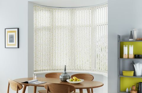 Edra gold vertical blind in curved bay window