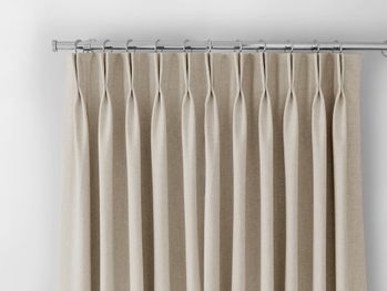 lyon oatmeal double pinch pleat curtain header on a silver curtain pole