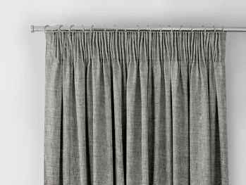haddie grey textured curtain header on a silver curtain pole