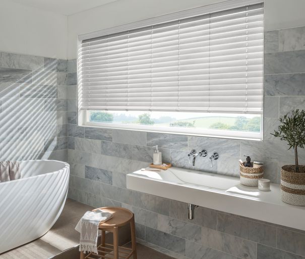 natural stone faux wood white blinds in bathroom