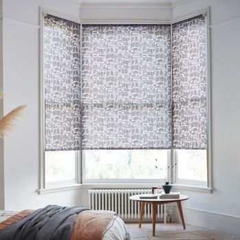 house beautiful matchsticks mono roller blind in bay window in bedroom