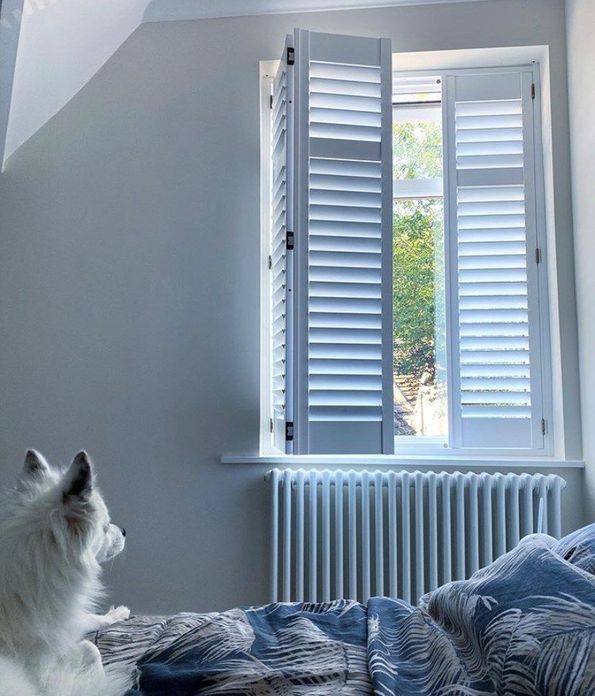 Aura white full height shutters in bedroom