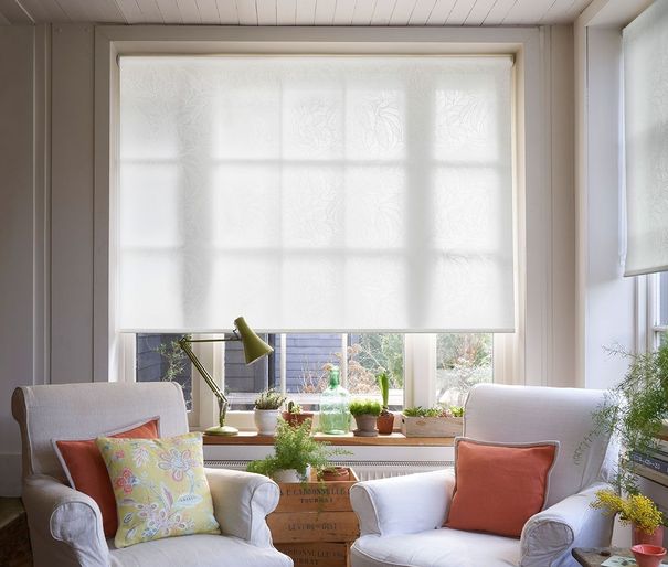 Greenery white roller blinds in cosy living room