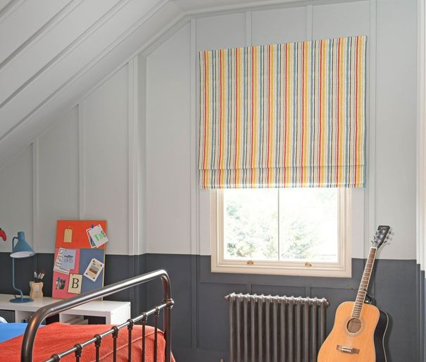 caspian fiesta striped roman blinds in bedroom