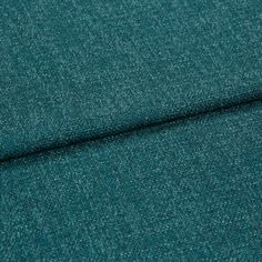 A folded piece of fabric with Boheme Teal printed on it
