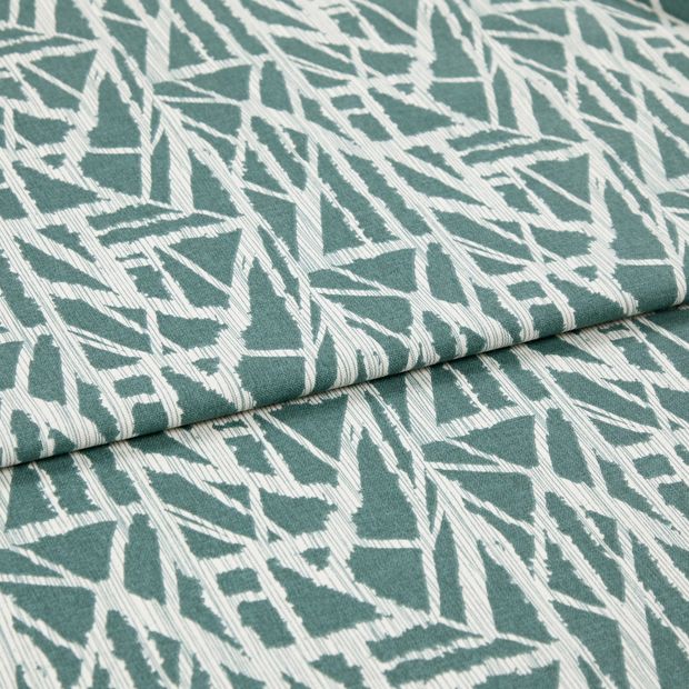 A folded piece of fabric with Alder Ocean Green printed on it