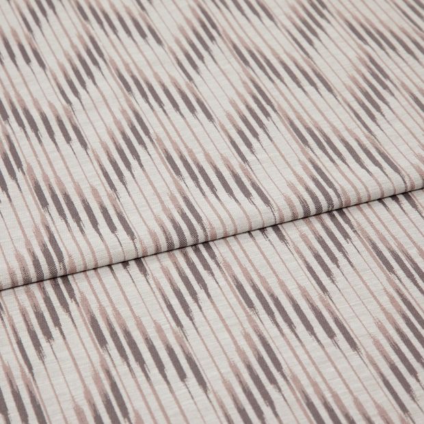 A folded piece of fabric with Diffuse Rose Blush Pink printed on it