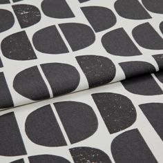 A folded piece of fabric with Burt Eclipse Black & White printed on it