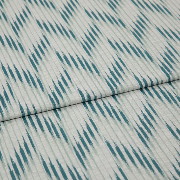 A folded piece of fabric with Diffuse Jade Blue printed on it