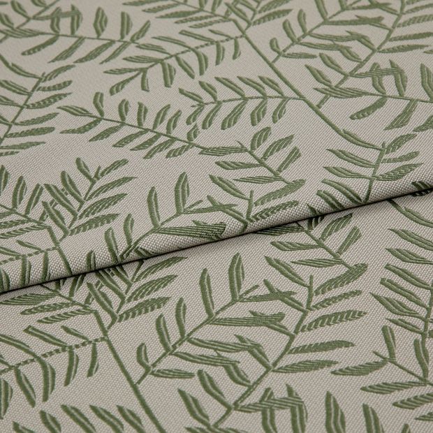 A folded piece of fabric with Fronds Fir Yellow printed on it