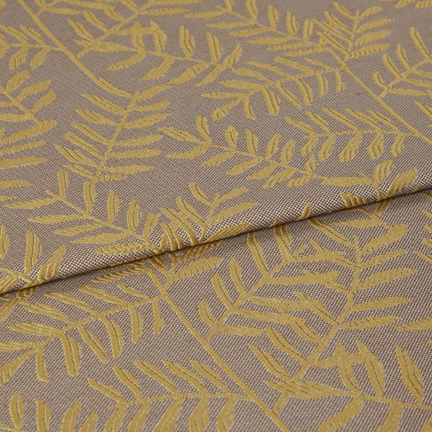 A folded piece of fabric with Fronds Harvest Cream printed on it
