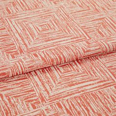 A folded piece of fabric with Gilmore Fiesta Red printed on it