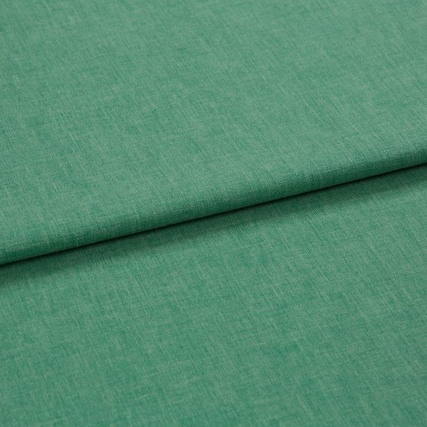 A folded piece of fabric with Harper Jade Light Green printed on it
