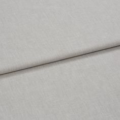 A folded piece of fabric with Harper Mallow Silver printed on it
