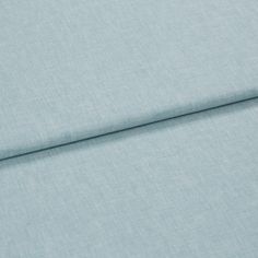 A folded piece of fabric with Harper Mist Blue printed on it