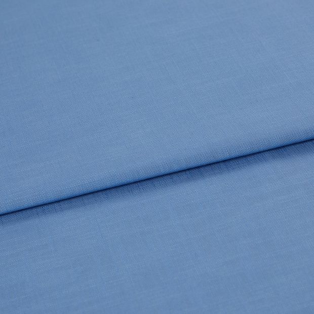 A folded piece of fabric with Faso Cornflower Blue printed on it