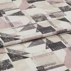 A folded piece of fabric with Fraction Rumba Pink printed on it