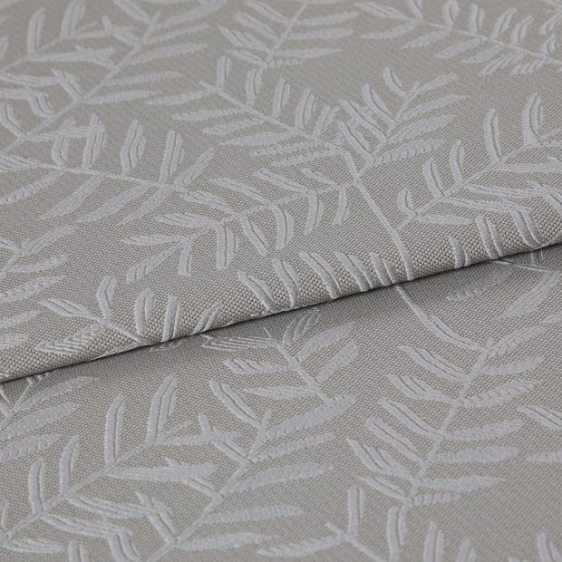 A folded piece of fabric with Fronds Ash Grey printed on it