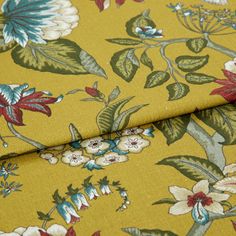 A folded piece of fabric with Manisha Golden Yellow printed on it