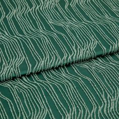 A folded piece of fabric with Maud Mallard Green printed on it