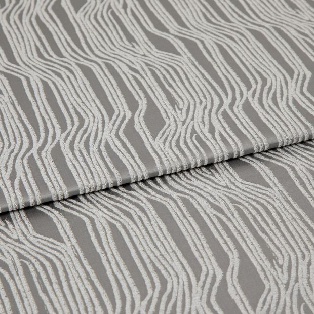 A folded piece of fabric with Maud Steel Grey printed on it