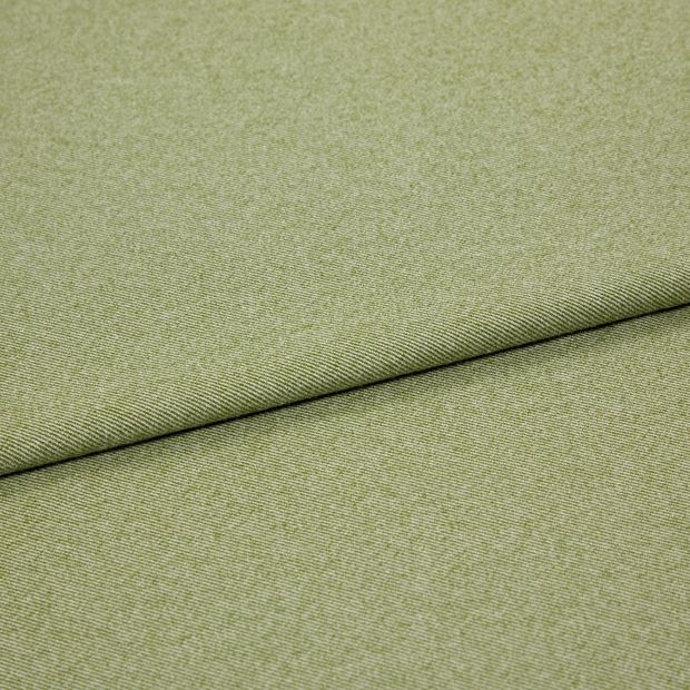 A folded piece of fabric with Huxley Moss Light Green printed on it