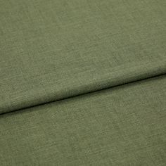 A folded piece of fabric with Lindora Pesto Green printed on it
