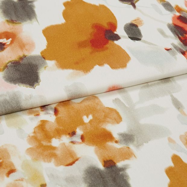 A folded piece of fabric with Livia Jaffa Orange printed on it