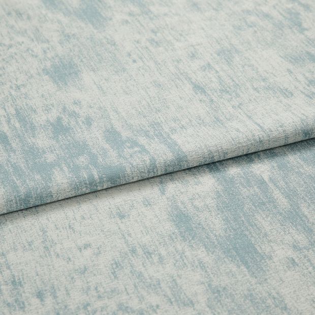 A folded piece of fabric with Spectre Arctic Blue printed on it