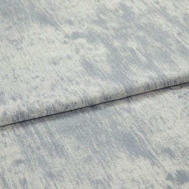 A folded piece of fabric with Spectre Ash Grey printed on it