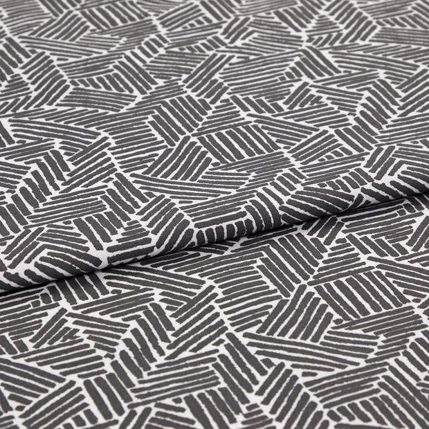 A folded piece of fabric with Parquet Jet Black printed on it