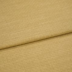 A folded piece of fabric with Pearl Wheat Gold printed on it