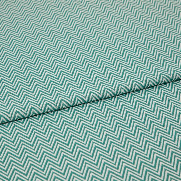 A folded piece of fabric with Pippa Aqua Light Green printed on it