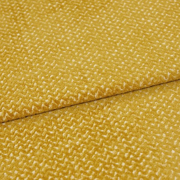A folded piece of fabric with Wave Sulphur Yellow printed on it