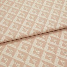 A folded piece of fabric with Zircon Rosedust Pink printed on it
