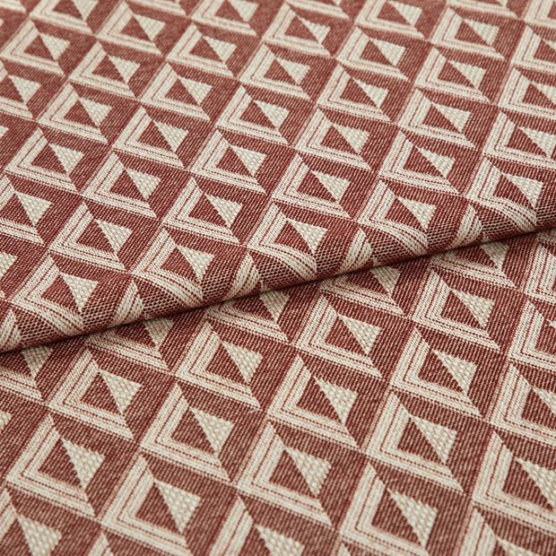 A folded piece of fabric with Zircon Spice Red printed on it
