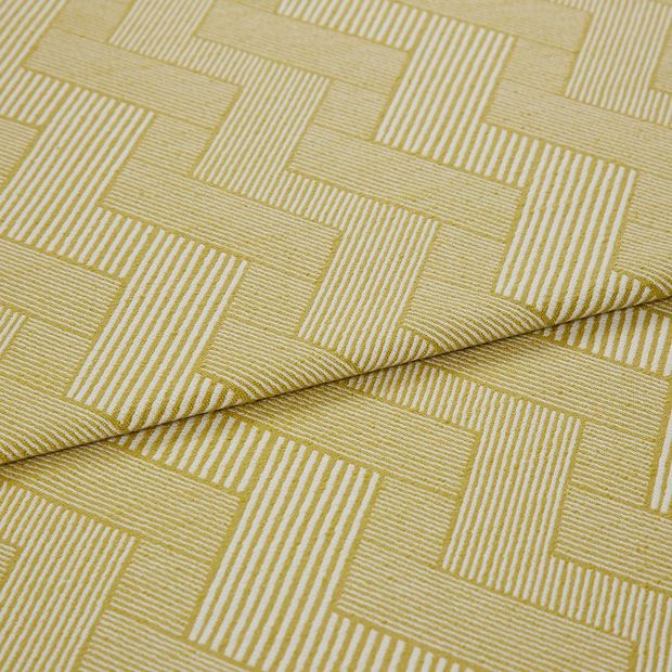 A folded piece of fabric with Rebel Citron Yellow printed on it