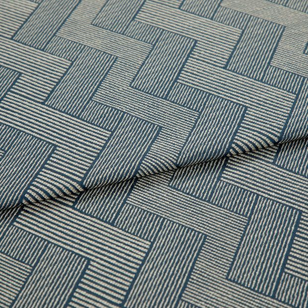 A folded piece of fabric with Rebel Indigo Blue printed on it