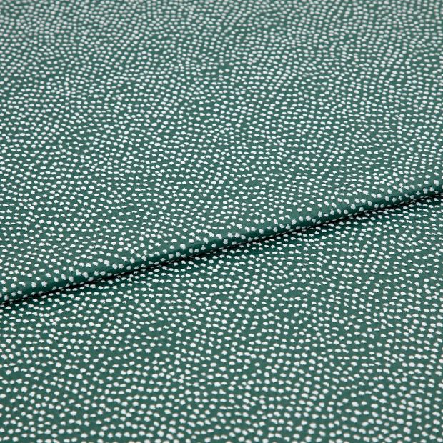 A folded piece of fabric with Spritz Elm Green printed on it