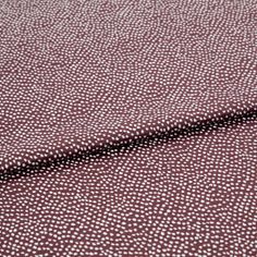 A folded piece of fabric with Spritz Grape Purple printed on it