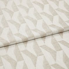 A folded piece of fabric with Vector Natural Cream printed on it