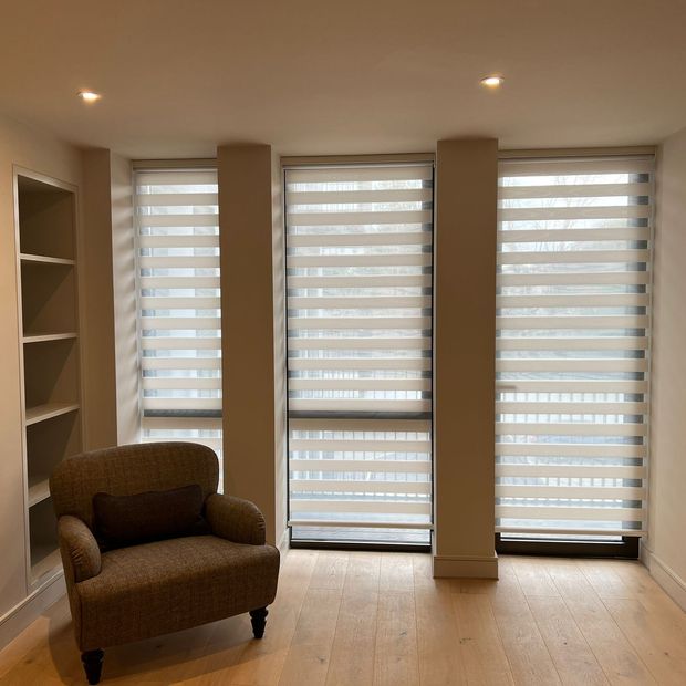 Prism white floor length day & night blinds in unfurnished living room