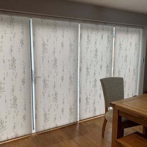 Somma white fully closed roller blinds in dining room