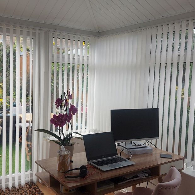 Malin white vertical blinds in conservatory