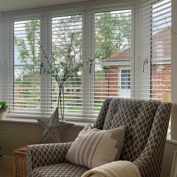 Haywood silk white wooden blinds in living room bay window