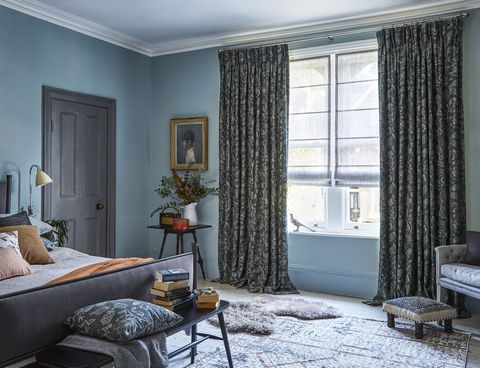 Anika Grey floor length pinch pleat curtains paired with voile roman blinds in bedroom