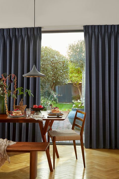 Clarence denim pinch pleat curtains on sliding door windows in dining room