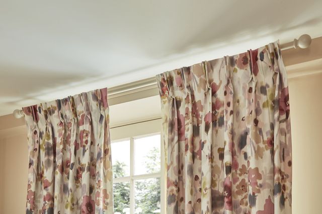 Livia sorbet pinch pleat floral pink curtains on french doors in living room