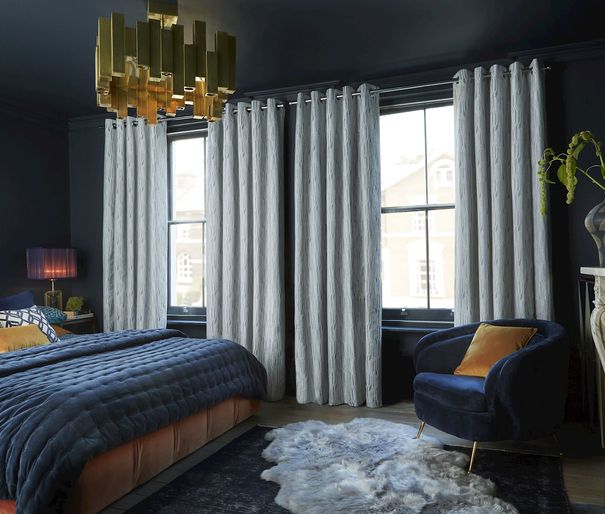 Maud steel floor length eyelet curtains in dark themed bedroom